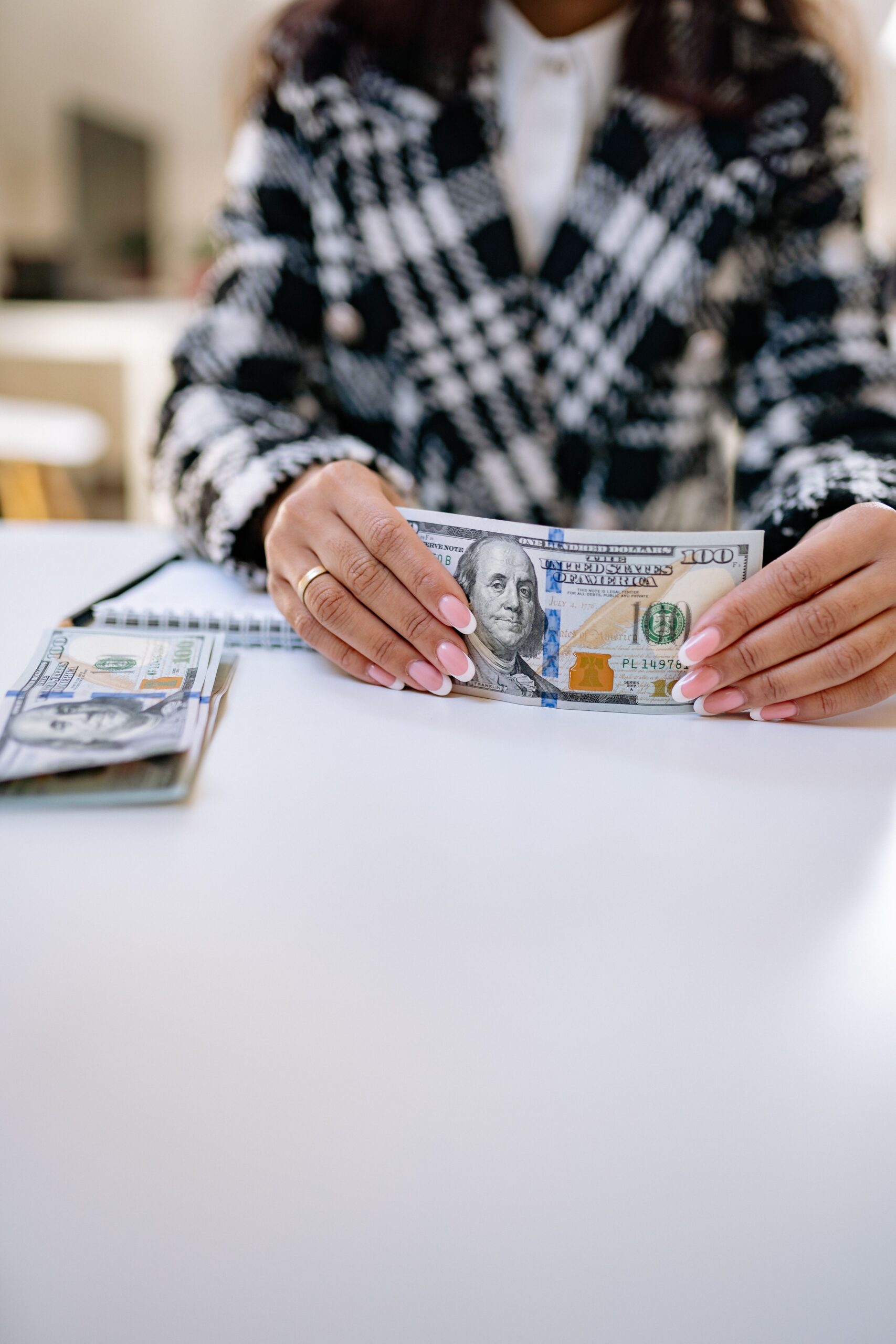 10 Common Money Mistakes and How to Avoid Them A lady holding Money